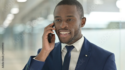 Portrait of African Businessman Talking on Phone 