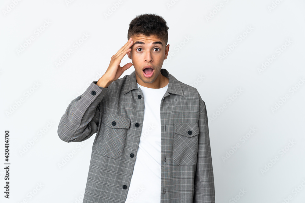Young brazilian man isolated on white background has realized something and intending the solution Young brazilian man isolated on white background has realized something and intending the solution