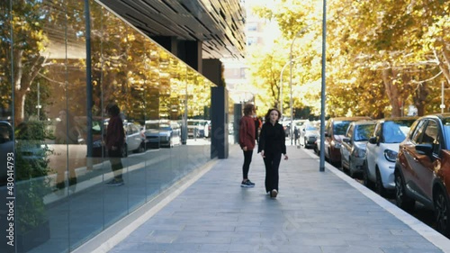 quarrel between friends - young woman chases her warlike friend who rejects her