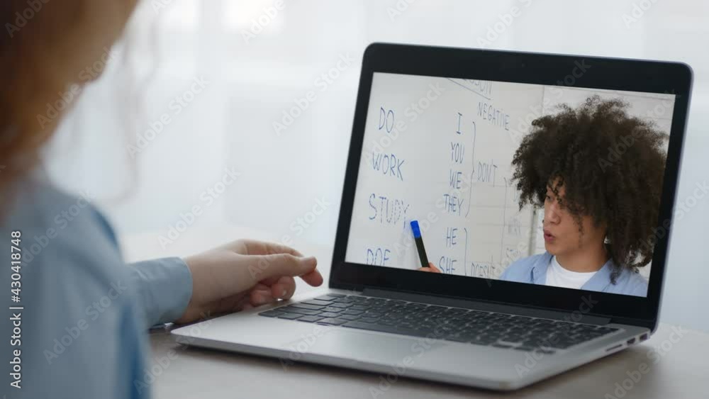 Woman At Laptop Watching Online Lecture With English Teacher Indoors Woman At Laptop Watching Online Lecture With English Teacher Indoors