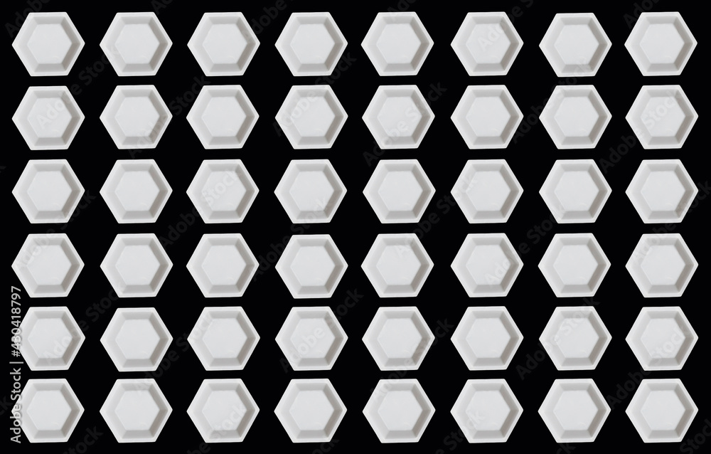 Polygon of hexagons. White plastic hexagonal weighing trays background. Optical illusion. Polygon of hexagons. White plastic hexagonal weighing trays background. Optical illusion.