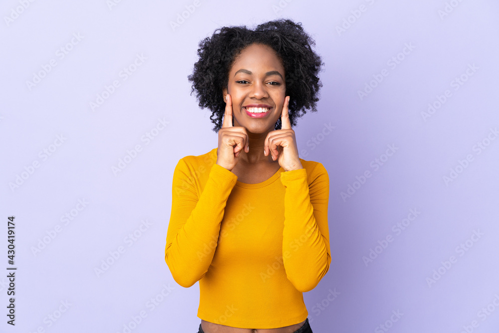 Young African American woman isolated on purple background smiling with a happy and pleasant expression Young African American woman isolated on purple background smiling with a happy and pleasant expression