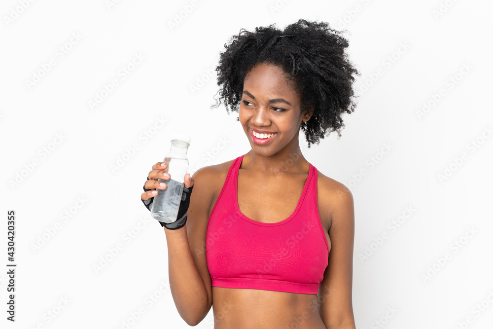 Young African American woman isolated on white background with sports water bottle Young African American woman isolated on white background with sports water bottle