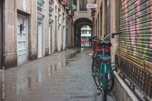 bicycle blue on city street rainy day