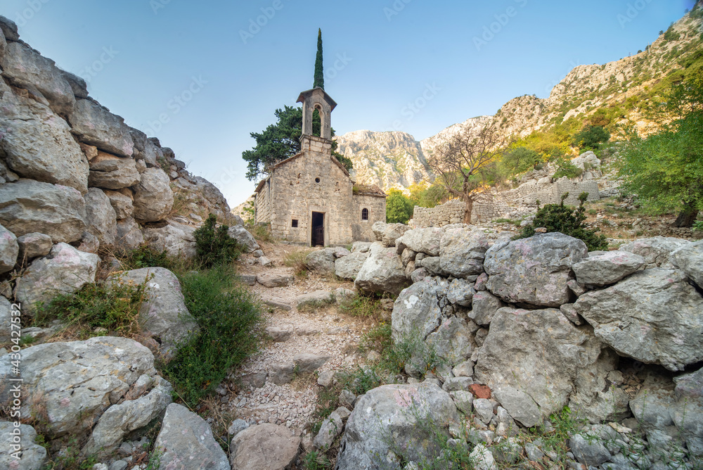 St John's church,surrounded by beautiful rocky mountain scenery at sunset, Kotor,Montenegro.