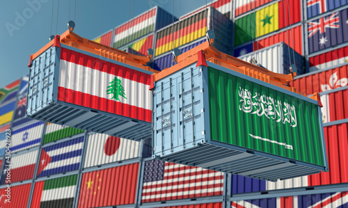 Freight containers with Lebanon and Saudi Arabia national flags. 3D Rendering © Marius Faust