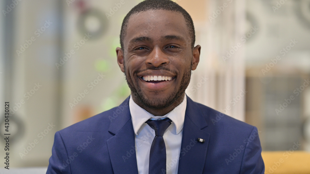 Portrait of Cheerful African Businessman Smiling at the Camera Portrait of Cheerful African Businessman Smiling at the Camera