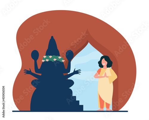 Happy Indian woman praying in temple. God, prayer, belief flat vector illustration. Religion and tradition concept for banner, website design or landing web page