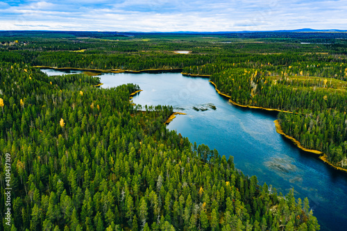 Aerial view of green forests and blue lakes and rivers in summer Finland