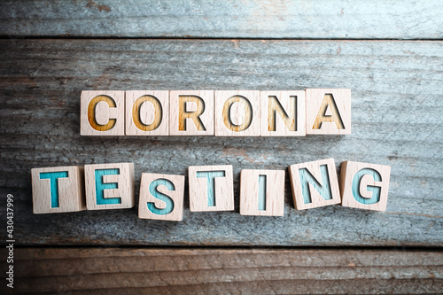 Corona Testing Written On Wooden Blocks On A Board photo