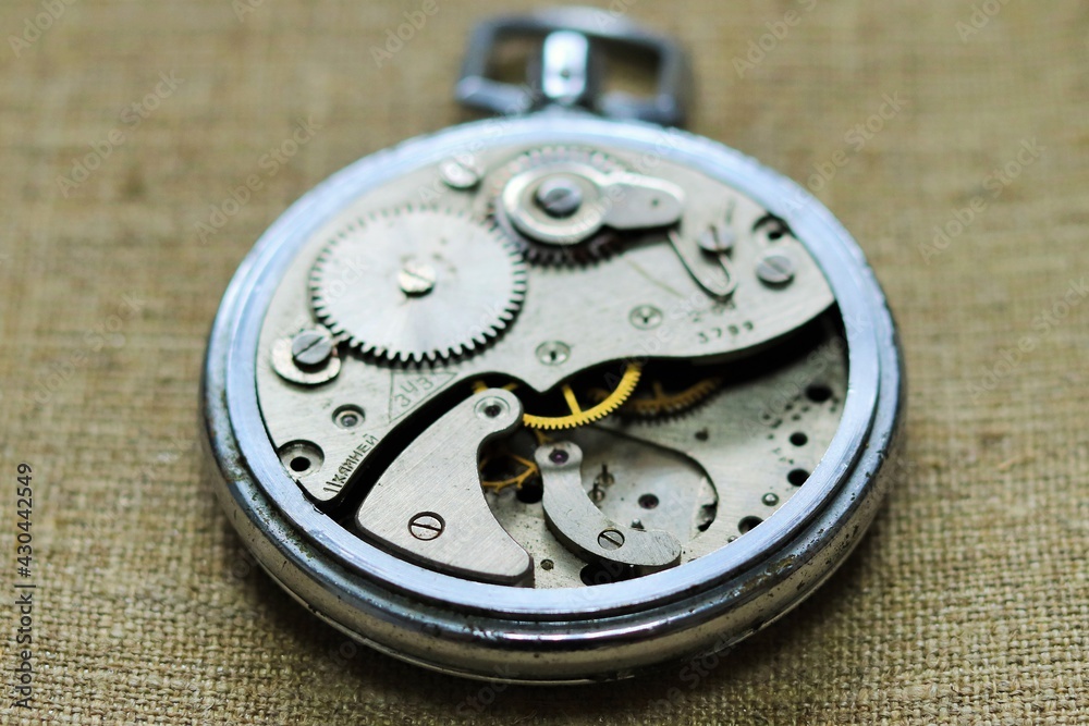 Old pocket watch mechanism, clockwork 