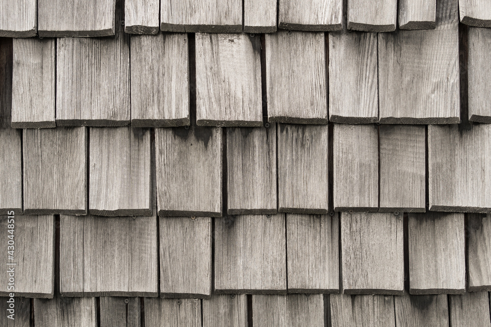 Wood background made of old gray planks. Wooden roof shingle. Wood background made of old gray planks. Wooden roof shingle.