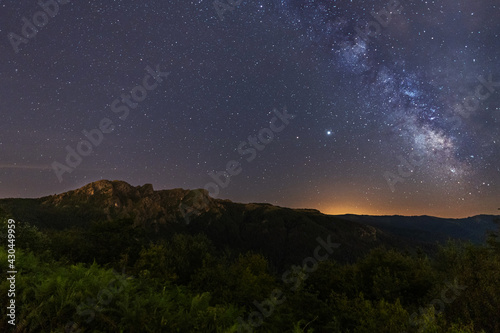 Milky way over the top of a beautiful mountain, Mount Peñas de Aya in the town of Oiartzun, Gipuzkoa. Spain