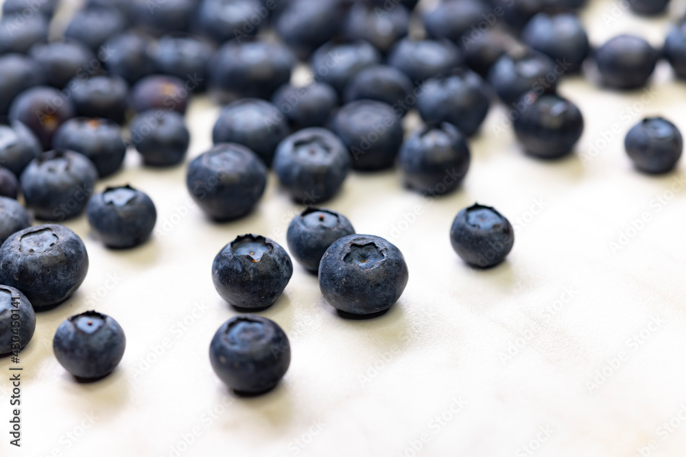still life with blueberries on a white patterned background still life with blueberries on a white patterned background
