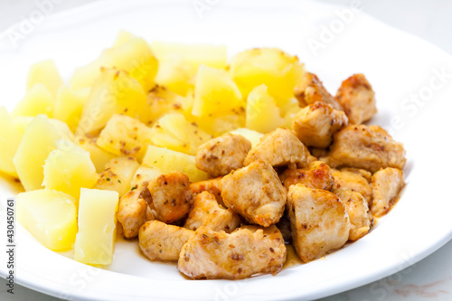 pork meat on cumin with potatoes