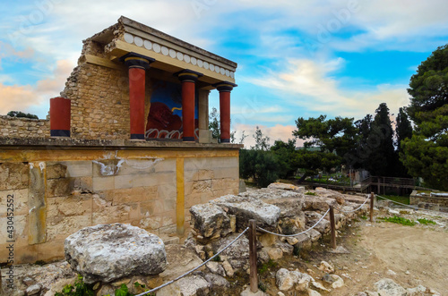 Knossos Palace, Crete, Greece. Restored North Entrance with the Charging Bull fresco at the famous archaeological site of Knossos. Sunset, cloudy sky, famous place