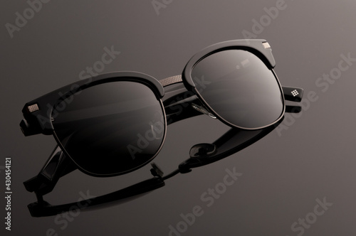  sunglasses on gray background .