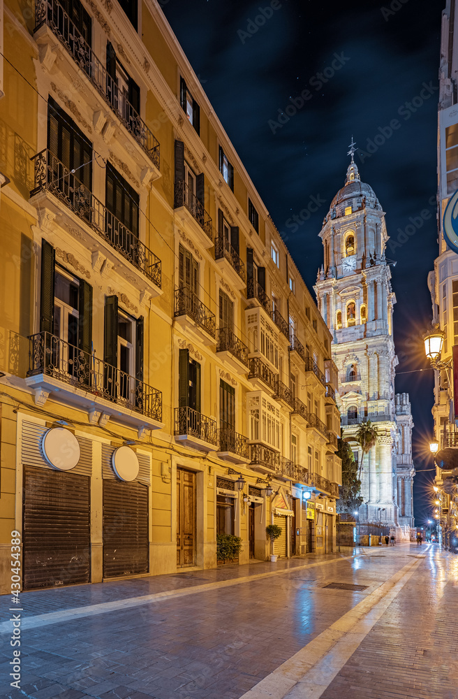 Fototapeta premium Night view streets and the cathedral in Malaga, Spain. Beautiful cityscape of the sightseeing spots of the city