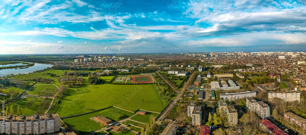 aerial panorama of the western outskirts of the city of Krasnodar near the Kuban River in the spring end of the day before sunset