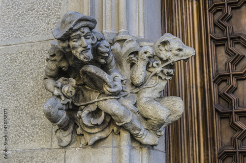 Building facade: Architectural fragments of ancient buildings in Barcelona, Spain.
