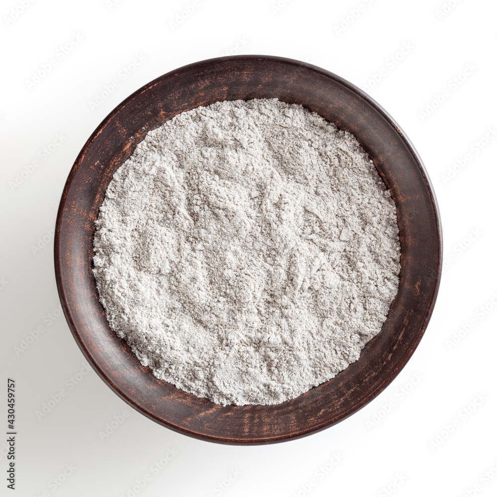 Rye flour in ceramic bowl isolated on white background with clipping path