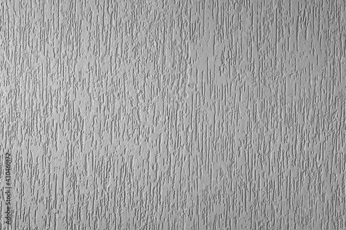 Plastered surface of a wall with light gray grooves. in Brazil known as grafiato. horizontal cut photo