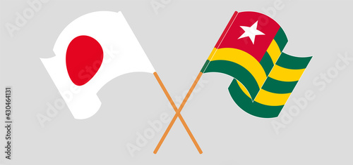 Crossed and waving flags of Japan and Togo
