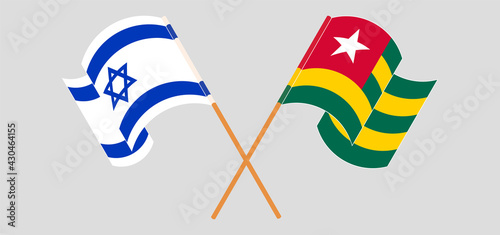 Crossed and waving flags of Israel and Togo