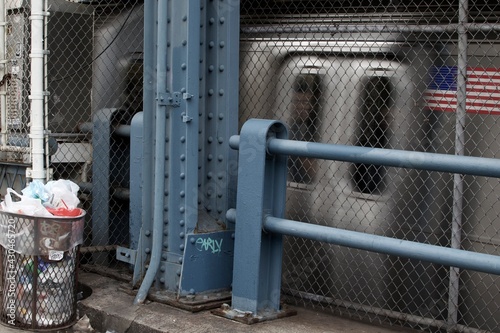A subway in motion on the street of New York City