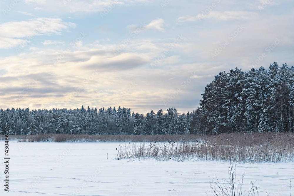 A view of the frozen and snow-capped lake Ändsjön on the island of Frösön in Sweden A view of the frozen and snow-capped lake Ändsjön on the island of Frösön in Sweden