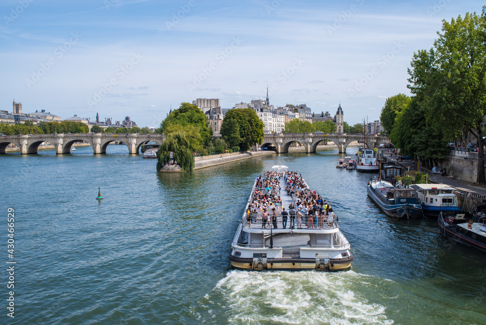 a ferry on the Seine river in Paris, France
