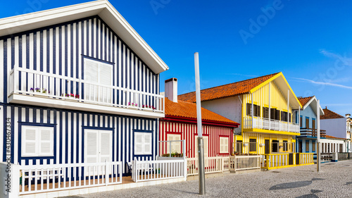 Street with colorful houses in Costa Nova, Aveiro, Portugal. Street with striped houses, Costa Nova, Aveiro, Portugal. Facades of colorful houses in Costa Nova, Aveiro, Portugal.