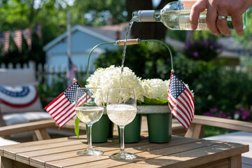 Pouring wine in the backyard on a holiday weekend