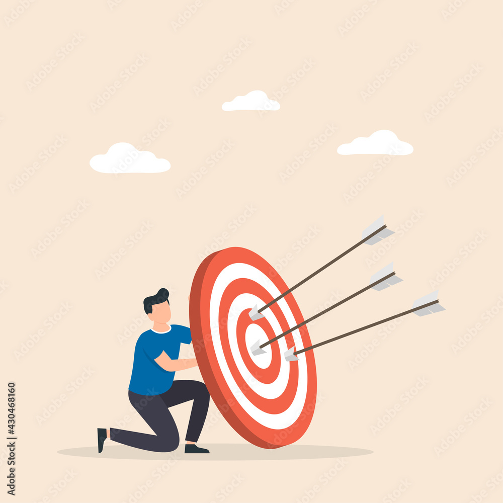 Man hold big target with arrow in bullseye. Purpose in business