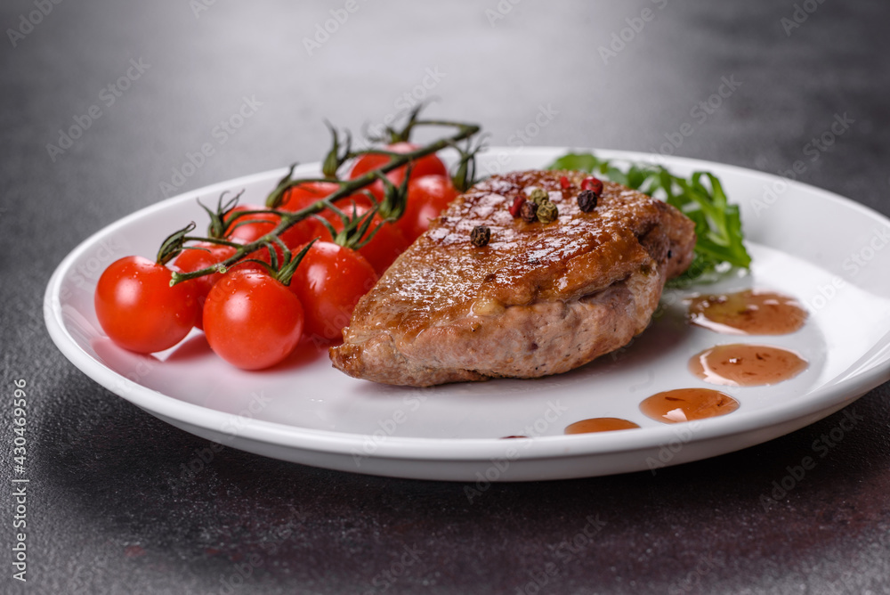 Baked duck breast with herbs and spices on a dark concrete background Baked duck breast with herbs and spices on a dark concrete background