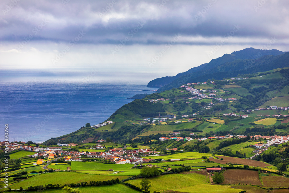 Naklejka premium Panoramic Aerial View of Povoacao in Sao Miguel, Azores Islands. Povoacao is a municipality located in the southeastern corner of the island of Sao Miguel in the Portuguese archipelago of the Azores.