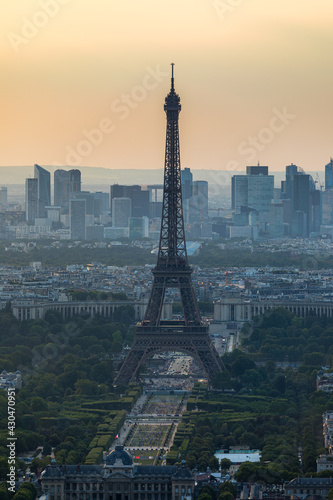 View of Paris with Eiffel Tower from Montparnasse building. Eiffel tower view from Montparnasse at sunset, view of the Eiffel Tower and La Defense district in Paris, France.