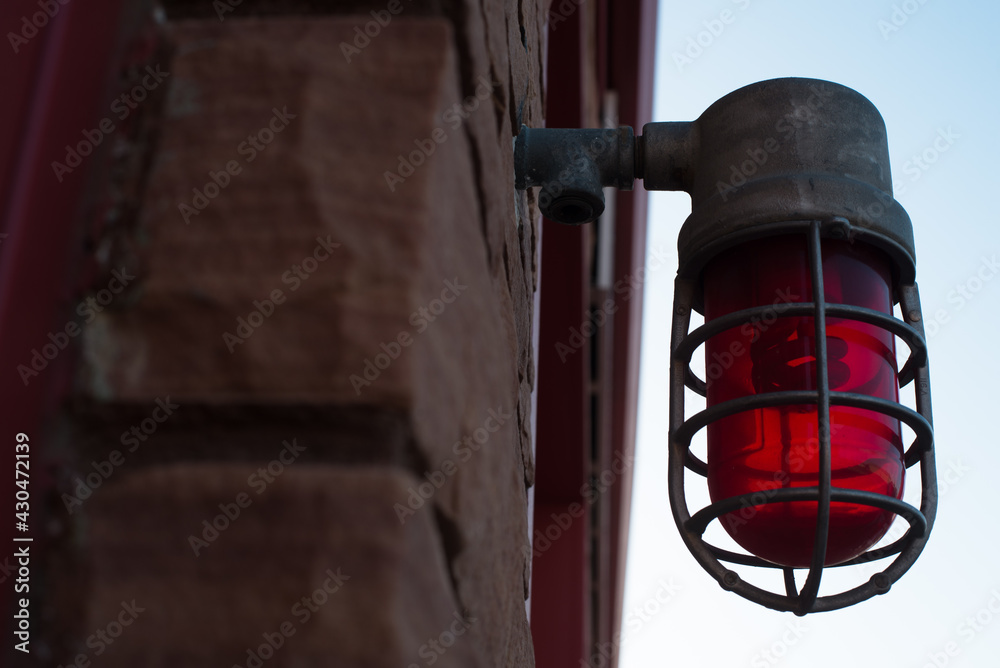 Old style vintage red light alert light on front of fire department station brick building zillah washington lower valley yakima county