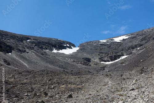 Snowy mountain pass with erosion and rockfall in the Khibiny mountains. The Kola peninsula, Russia photo