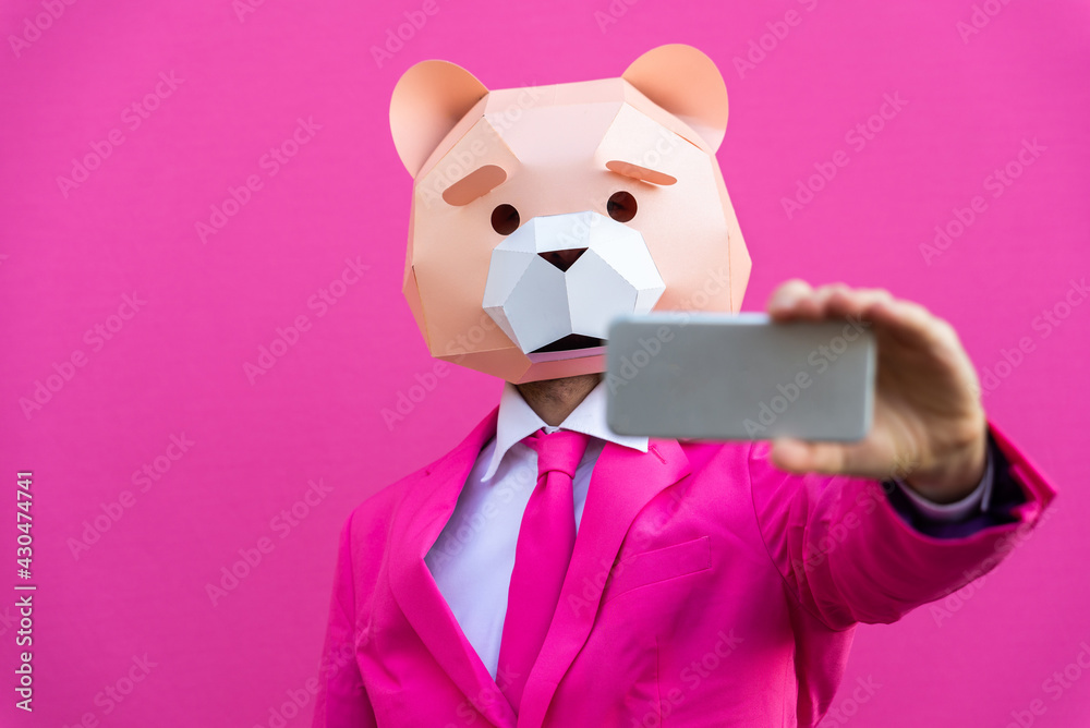 Man with funny low poly mask on colored background
