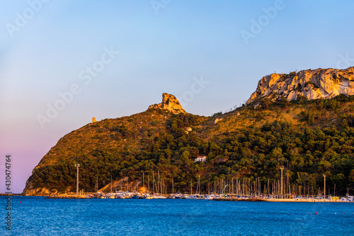 Beach of Cagliari (Poetto Sella del Diavolo) with Torre del Poetto tower and boats at sunset, Sardinia, Italy. photo