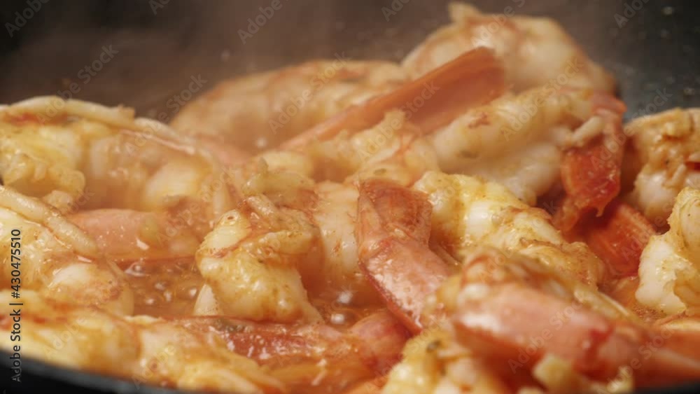 Cooking langoustine on frying pan. Preporation shrimps. Closeup Cooking langoustine on frying pan. Preporation shrimps. Closeup