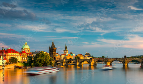 Charles Bridge in Prague in Czechia. Prague, Czech Republic. Charles Bridge (Karluv Most) and Old Town Tower. Vltava River and Charles Bridge. Concept of world travel, sightseeing and tourism.