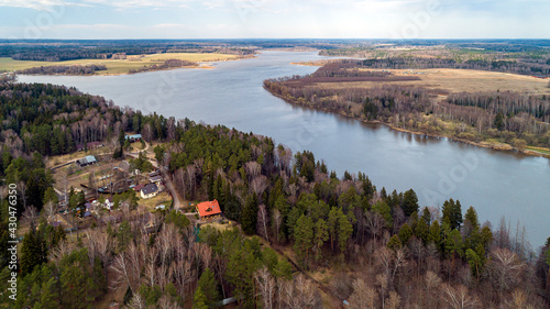 Ozerninskoe reservoir. artificial reservoir in Ruzsky urban district of Moscow region of Russia. Lake or river bank. Aerial view. Fields for crops in early spring. photo