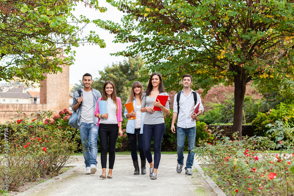 Group of students walking in a park