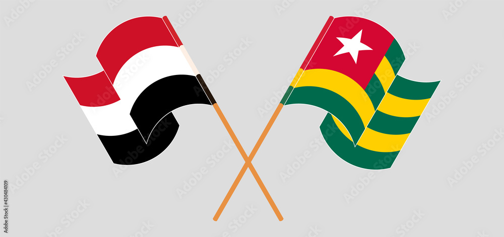 Crossed and waving flags of Yemen and Togo Crossed and waving flags of Yemen and Togo