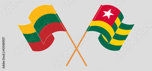 Crossed and waving flags of Lithuania and Togo