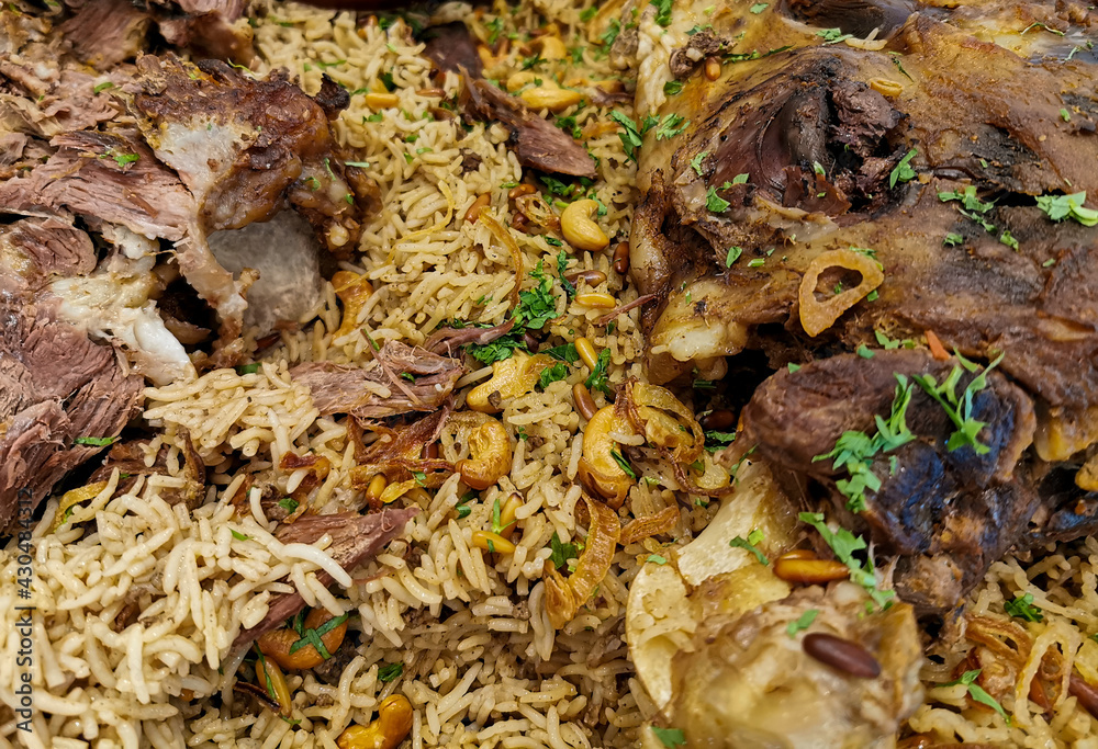 arabic ouzi lamb rice.A kind of traditional arabian rice served with lamb shank. Stuffed lamb with rice arabic ouzi lamb rice.A kind of traditional arabian rice served with lamb shank. Stuffed lamb with rice