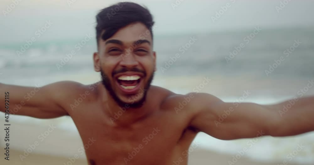 Friendly young Latin American man inviting to come to Brazil, confident and smiling making a gesture with his hand, being positive and friendly. Beach from Brazil. 4K. Friendly young Latin American man inviting to come to Brazil, confident and smiling making a gesture with his hand, being positive and friendly. Beach from Brazil. 4K.