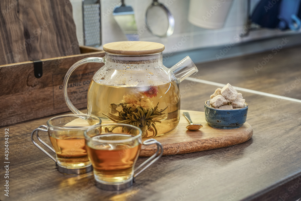 Fototapeta premium Blooming flowering tea in glass teapot